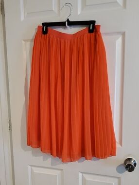 AND Pleated Midi Skirt in Vivid Orange
